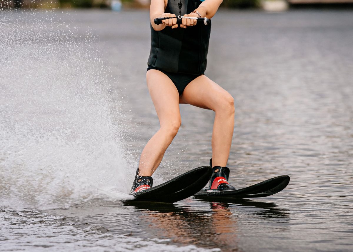 Close up of a person waterskiing.