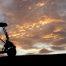 Photo promoting Golf Course Mechanic for Granite Hills Golf Club showing a silhouette of a golf cart during a sunset.